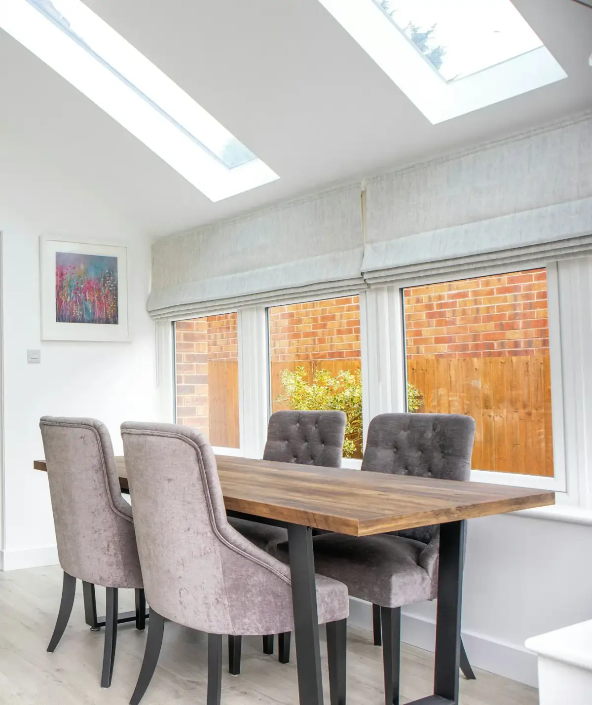 A room with a solid insulated roof, plastered ceiling and roof windows